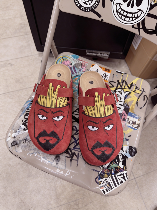 Frylock clogs on a graffiti-covered chair