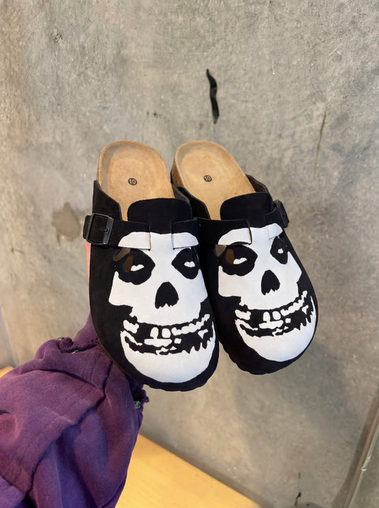 Black suede Misfits clogs with white Crimson Ghost skull graphic