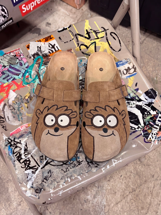 Rigby clogs on graffiti chair